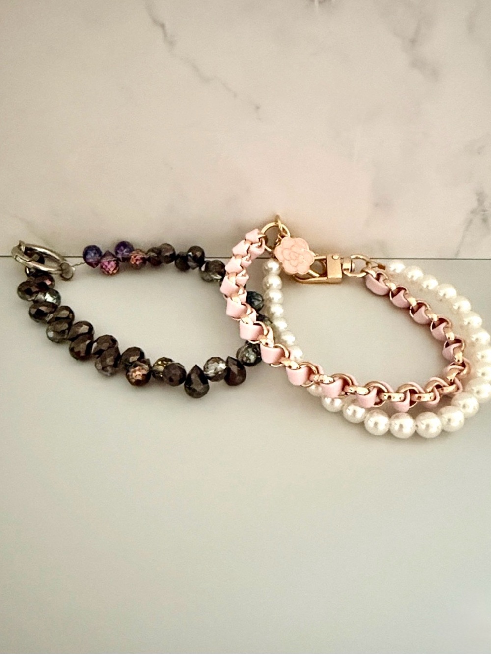 🩷💜2️⃣ keychains/bag charms in purple crystal, pink leather gold chain and pearls